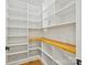 Walk-in pantry boasts custom shelving and butcher block countertops providing ample storage space at 4539 Polk Ford Rd, Stanfield, NC 28163