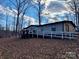 Single-story home with deck and ramp at 325 Scaley Bark Dr, Salisbury, NC 28147