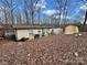 Rear view of mobile home and storage buildings at 325 Scaley Bark Dr, Salisbury, NC 28147