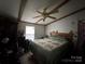 Main bedroom with ceiling fan, large bed, and dresser at 325 Scaley Bark Dr, Salisbury, NC 28147