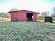 Red barn with open stall and gated entrance at 448 Johnson Dairy Rd, Mooresville, NC 28115