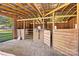 Empty horse stalls inside a rustic wooden barn at 448 Johnson Dairy Rd, Mooresville, NC 28115