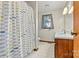 Bathroom with shower/tub, light blue sink, and wood vanity at 448 Johnson Dairy Rd, Mooresville, NC 28115