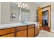 Bathroom with light wood vanity, a light blue sink, and a shower/tub at 448 Johnson Dairy Rd, Mooresville, NC 28115