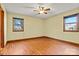 Bright bedroom with hardwood floors and two windows at 448 Johnson Dairy Rd, Mooresville, NC 28115