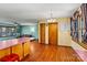 Bright dining area adjacent to the kitchen, with wood flooring at 448 Johnson Dairy Rd, Mooresville, NC 28115