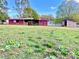 Two barns on a grassy field, one red, one wood at 448 Johnson Dairy Rd, Mooresville, NC 28115