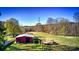 Open pasture with barn and power lines in background at 448 Johnson Dairy Rd, Mooresville, NC 28115