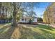 Small white house with front porch and large tree at 448 Johnson Dairy Rd, Mooresville, NC 28115