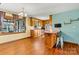 Kitchen with wood cabinets, laminate flooring, and a breakfast bar at 448 Johnson Dairy Rd, Mooresville, NC 28115