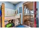 Laundry room with utility sink and access to a screened porch at 448 Johnson Dairy Rd, Mooresville, NC 28115