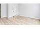 Bright bedroom with light wood floors and white walls at 7039 Executive Cir, Denver, NC 28037