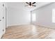 Well-lit bedroom featuring hardwood floors and large window at 7039 Executive Cir, Denver, NC 28037