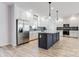 Modern kitchen with island and stainless steel appliances at 7039 Executive Cir, Denver, NC 28037