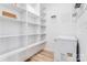 Large pantry with ample shelving and small freezer at 7039 Executive Cir, Denver, NC 28037