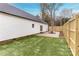 Side yard with patio and wooden fence at 7039 Executive Cir, Denver, NC 28037