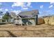 Green house exterior with backyard and wooden fence at 102 S Liberty St, Gastonia, NC 28052