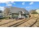 Green house exterior with backyard and wooden fence at 102 S Liberty St, Gastonia, NC 28052