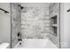 Elegant bathroom featuring marble tile shower and bathtub at 102 S Liberty St, Gastonia, NC 28052