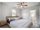 Spacious bedroom with ceiling fan and ensuite bathroom access at 102 S Liberty St, Gastonia, NC 28052