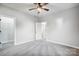 Bedroom with ceiling fan, carpet flooring and closet at 102 S Liberty St, Gastonia, NC 28052