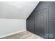 Spacious bedroom with gray shiplap accent wall and storage at 102 S Liberty St, Gastonia, NC 28052