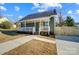 Newly built home with a welcoming front porch and landscaped yard at 102 S Liberty St, Gastonia, NC 28052