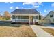 Newly built home with a welcoming front porch and landscaped yard at 102 S Liberty St, Gastonia, NC 28052