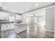 Modern kitchen with island and open concept to living area at 102 S Liberty St, Gastonia, NC 28052