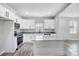 Modern kitchen with white cabinets, granite countertops, and island at 102 S Liberty St, Gastonia, NC 28052