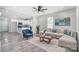 Bright living room with L-shaped sofa and view into the kitchen area at 102 S Liberty St, Gastonia, NC 28052