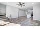 Open living room with hardwood floors and kitchen island at 102 S Liberty St, Gastonia, NC 28052