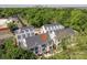 An aerial shot shows the townhome complex with modern architecture, surrounded by lush greenery and city skyline at 1419 Collier Walk Aly # Csw0208, Charlotte, NC 28205