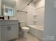 Bathroom with modern vanity and bath with shower at 1419 Collier Walk Aly # Csw0208, Charlotte, NC 28205