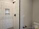 Detail of new bathroom with walk-in shower and black fixtures at 1419 Collier Walk Aly # Csw0208, Charlotte, NC 28205