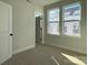 Bedroom with new neutral carpeting and natural light at 1419 Collier Walk Aly # Csw0208, Charlotte, NC 28205
