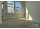 Bedroom with new neutral carpeting and natural light at 1419 Collier Walk Aly # Csw0208, Charlotte, NC 28205