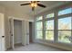 Bright bedroom with multiple windows offering natural light and closet with white bi-fold doors at 1419 Collier Walk Aly # Csw0208, Charlotte, NC 28205