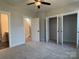 Bedroom featuring plush carpeting, closet space, and an ensuite bathroom at 1419 Collier Walk Aly # Csw0208, Charlotte, NC 28205