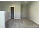 Spacious bonus room features neutral paint and plush carpeting, creating a welcoming atmosphere at 1419 Collier Walk Aly # Csw0208, Charlotte, NC 28205
