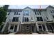 Stylish townhome showcasing modern architectural details, including a brick facade at 1419 Collier Walk Aly # Csw0208, Charlotte, NC 28205