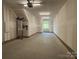 Spacious two-car garage with ample storage space and an unfinished interior at 1419 Collier Walk Aly # Csw0208, Charlotte, NC 28205