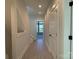 Bright hallway with wood-look floors and access to other rooms at 1419 Collier Walk Aly # Csw0208, Charlotte, NC 28205