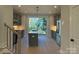Modern kitchen features a central island, stainless steel appliances, and lots of natural light at 1419 Collier Walk Aly # Csw0208, Charlotte, NC 28205