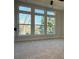 Main bedroom with lots of natural light from large windows at 1419 Collier Walk Aly # Csw0208, Charlotte, NC 28205