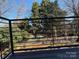 Relaxing balcony offering a peaceful view of lush greenery and a fenced backyard at 1421 Collier Walk Aly # Csw0209, Charlotte, NC 28205