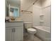 Modern bathroom with white vanity and gold fixtures at 1421 Collier Walk Aly # Csw0209, Charlotte, NC 28205