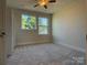 Bright bedroom with carpet flooring and ceiling fan at 1421 Collier Walk Aly # Csw0209, Charlotte, NC 28205