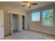 Spacious bedroom with carpet flooring, large closet and windows at 1421 Collier Walk Aly # Csw0209, Charlotte, NC 28205