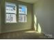 Bright bedroom with neutral walls and carpet flooring at 1421 Collier Walk Aly # Csw0209, Charlotte, NC 28205